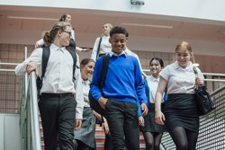 A group of secondary school students walking. 