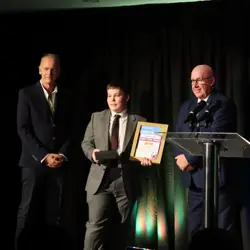 Archie Matthews accepting the Outstanding Achievement 4Uth Award 2025